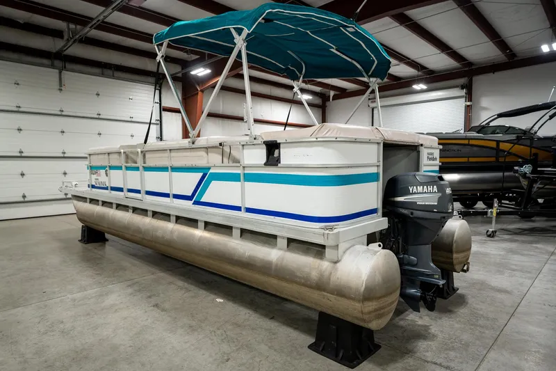 Slide: The Image of 1992 Harris FloteBote 240 Super Sunliner pontoon boat with Yamaha motor in a warehouse. - 9