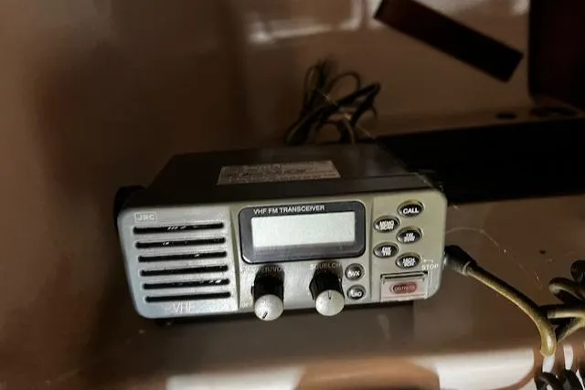 Slide: The Image of VHF FM transceiver on 1977 Cape Dory Sloop, featuring control knobs and display. - 9