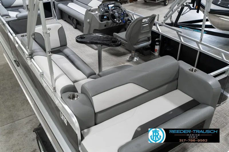 Slide: The Image of 2023 Avalon 2180 Vent CR pontoon boat interior with gray seating and modern dashboard. - 15