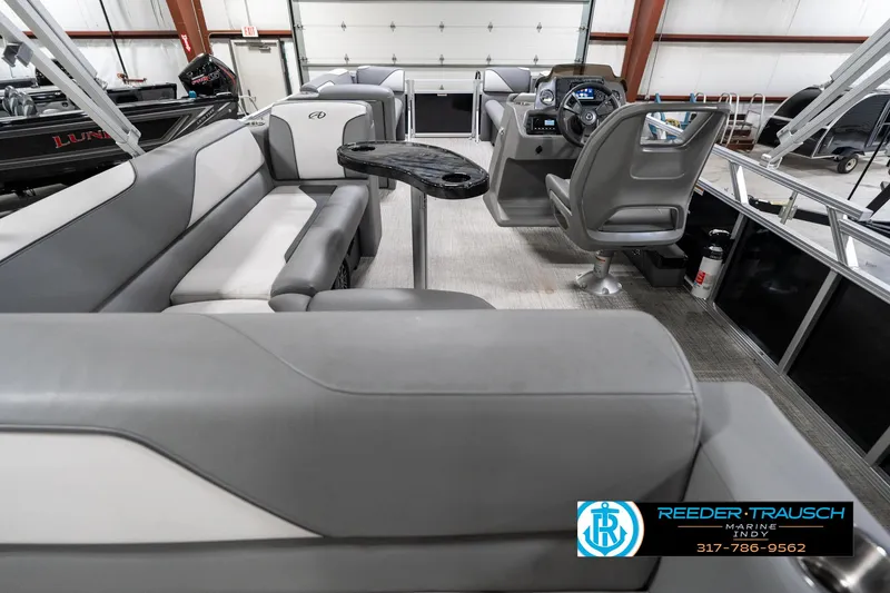 Slide: The Image of Interior of 2023 Avalon 2180 Vent CR pontoon boat with gray seating and steering console. - 19