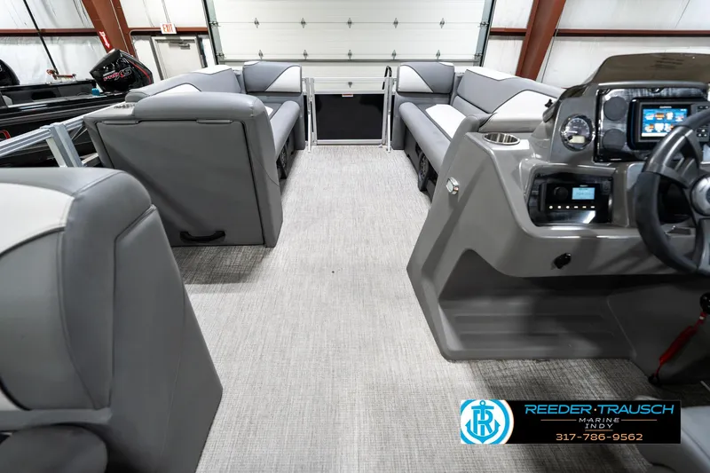 Slide: The Image of Interior of 2023 Avalon 2180 Vent CR pontoon boat with gray seating and modern dashboard. - 20