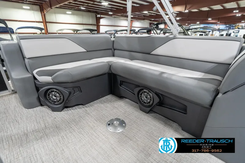 Slide: The Image of Luxurious seating in 2023 Avalon 2180 Vent CR pontoon boat, featuring modern design and built-in speakers. - 26