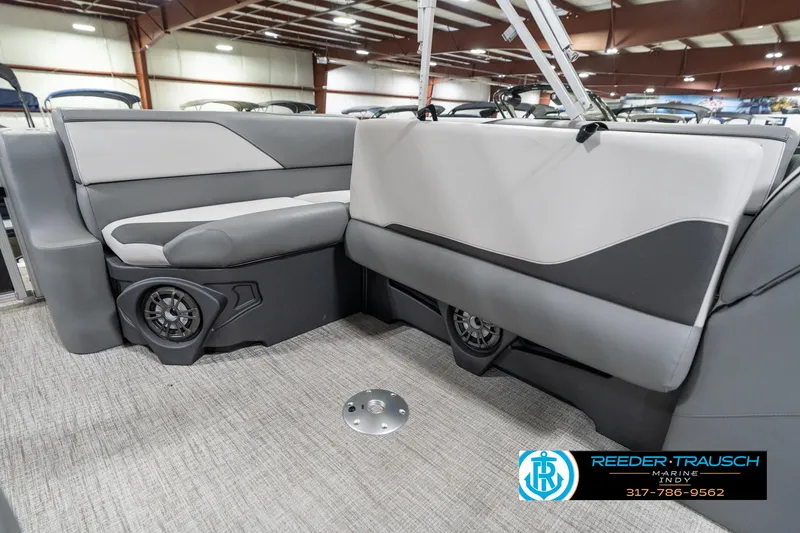 Slide: The Image of 2023 Avalon 2180 Vent CR boat interior with gray seating and built-in speakers. - 27