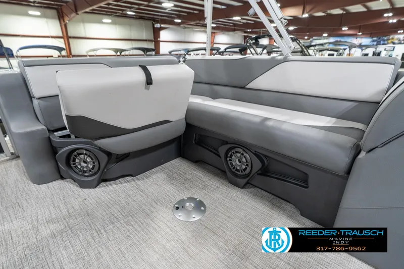 Slide: The Image of 2023 Avalon 2180 Vent CR boat interior with gray seating and built-in speakers. - 28