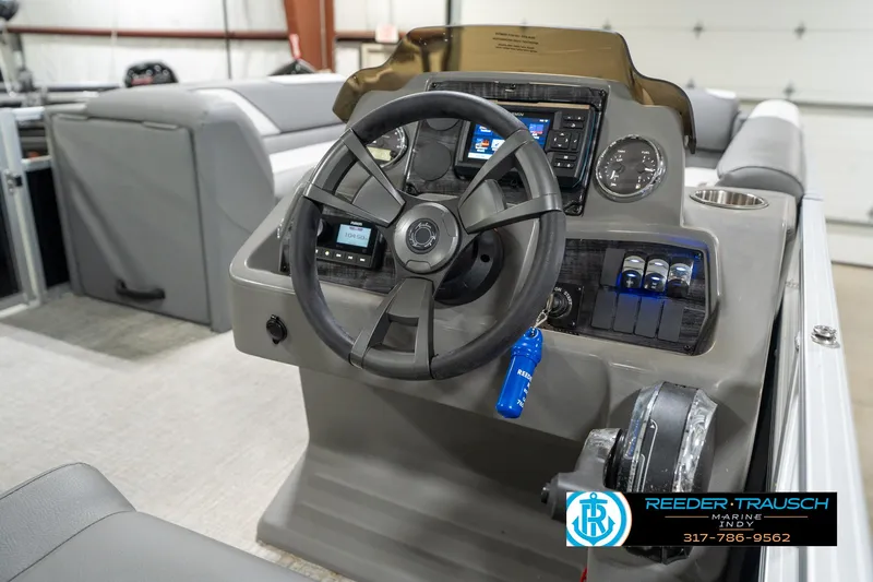 Slide: The Image of 2023 Avalon 2180 Vent CR boat dashboard with steering wheel and control panel. - 31