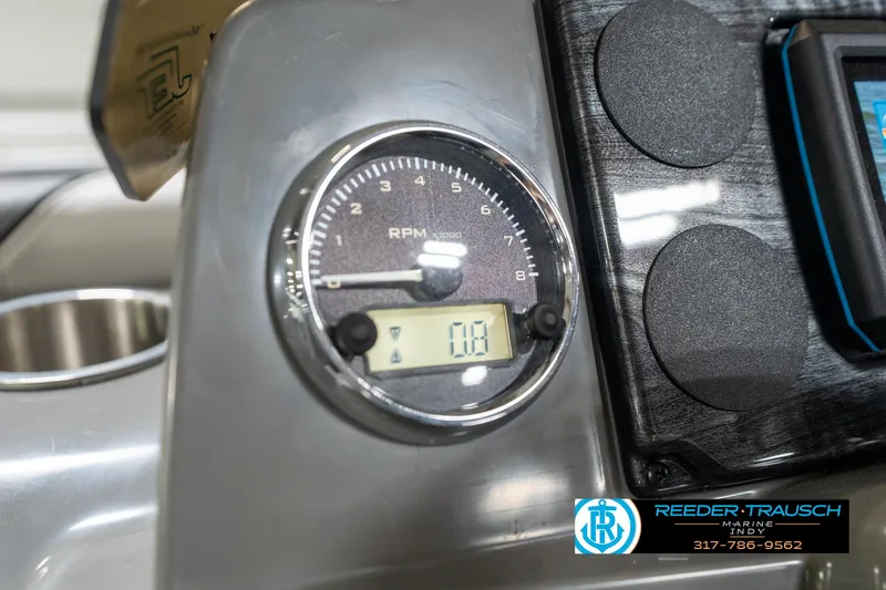 Slide: The Image of Dashboard of 2023 Avalon 2180 Vent CR boat with RPM gauge and digital display. - 35