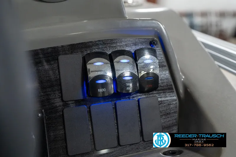 Slide: The Image of Control panel of 2023 Avalon 2180 Vent CR boat with illuminated switches. - 38