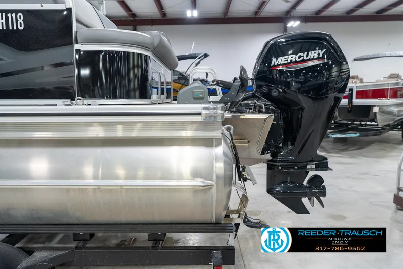 Slide: The Image of 2023 Avalon 2180 Vent CR pontoon boat with Mercury outboard motor in showroom. - 47