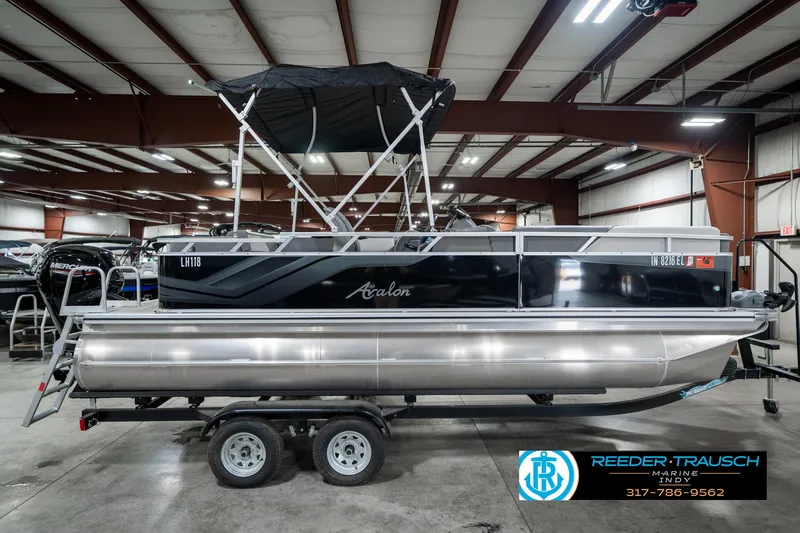 Slide: The Image of 2023 Avalon 2180 Vent CR pontoon boat on trailer in indoor showroom. - 7
