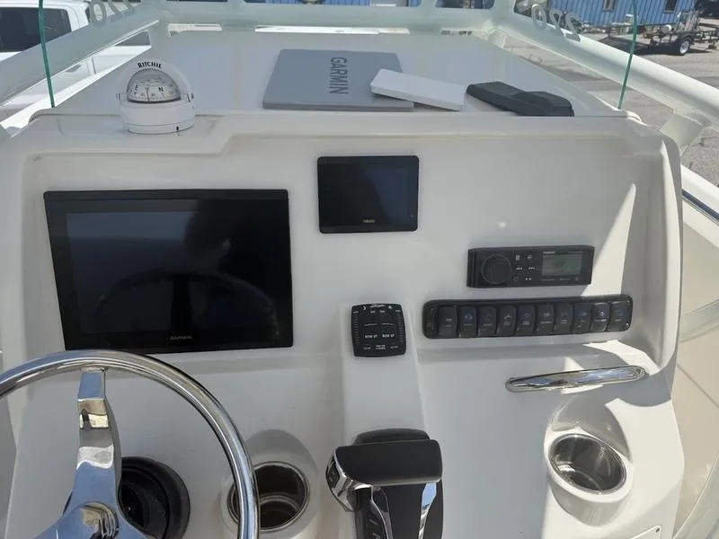 Slide: The Image of Helm of 2023 Sailfish 220 boat with Garmin electronics and Ritchie compass. - 14