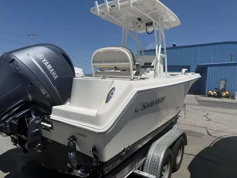 Slide: The Image of 2023 Sailfish 220 boat with Yamaha engine on trailer, parked outdoors. - 8