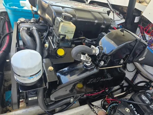 Slide: The Image of Engine of a 1996 Formula 232 LS boat, showcasing detailed components and wiring. - 12