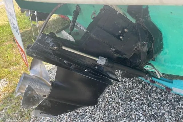 Slide: The Image of Close-up of a 1996 Formula 232 LS boat's propeller and outdrive on gravel. - 13