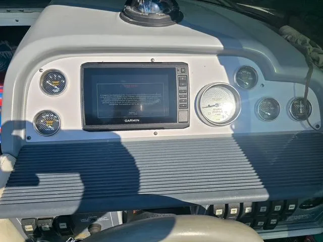 Slide: The Image of Dashboard of a 1996 Formula 232 LS boat with Garmin navigation system. - 4