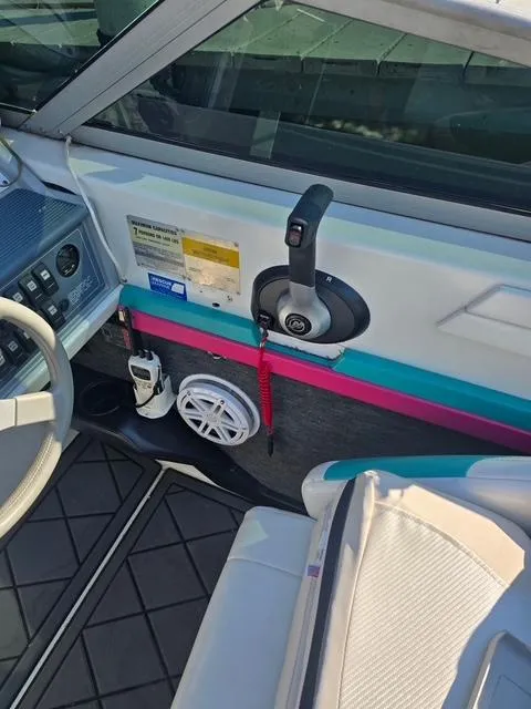 Slide: The Image of Interior of a 1996 Formula 232 LS boat showing controls and seating. - 5