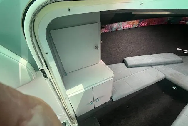 Slide: The Image of Interior cabin of a 1996 Formula 232 LS boat with seating and storage. - 9