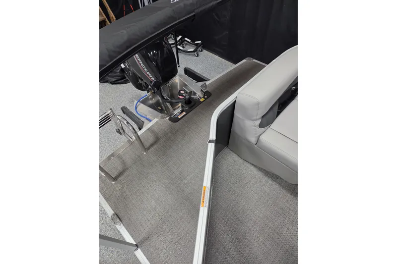 Slide: The Image of 2026 Barletta Aria A20L boat interior with motor and seating area. - 12