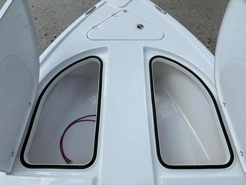 Slide: The Image of Open storage compartments on a 2026 Blazer 2440 boat deck. - 10