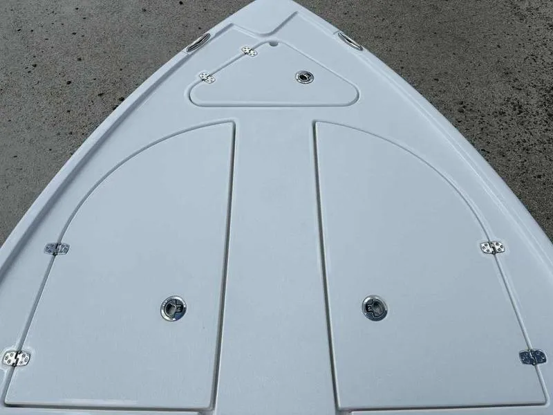 Slide: The Image of Bow of 2026 Blazer 2440 boat with storage compartments and sleek design. - 13