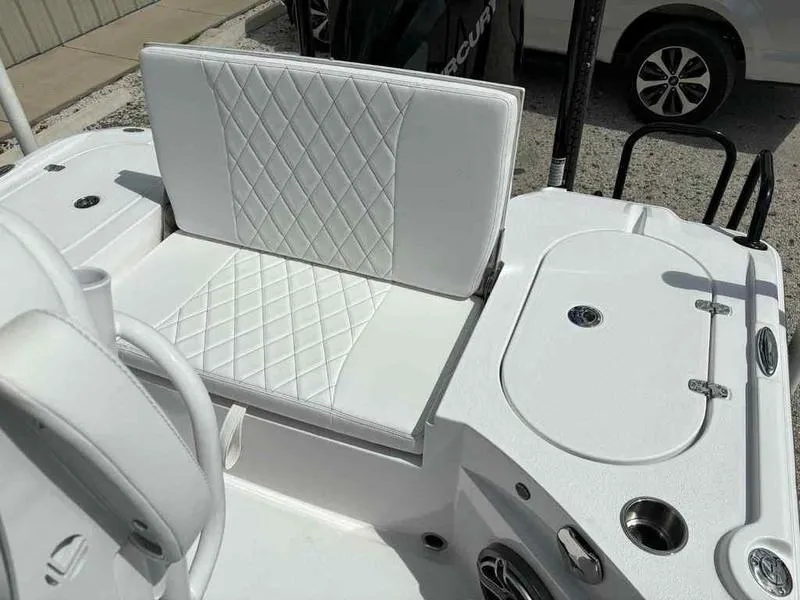 Slide: The Image of White seating area on a 2026 Blazer 2440 boat with diamond stitching. - 14