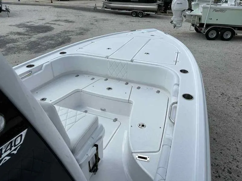 Slide: The Image of 2026 Blazer 2440 boat deck with seating and storage compartments. - 16