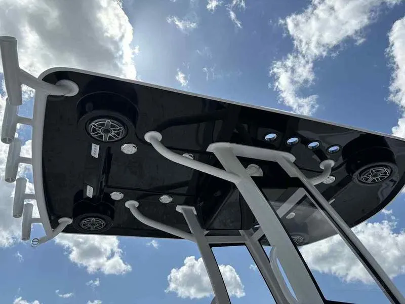 Slide: The Image of Upside-down Blazer 2440 model sculpture against a cloudy sky, 2026 design. - 6