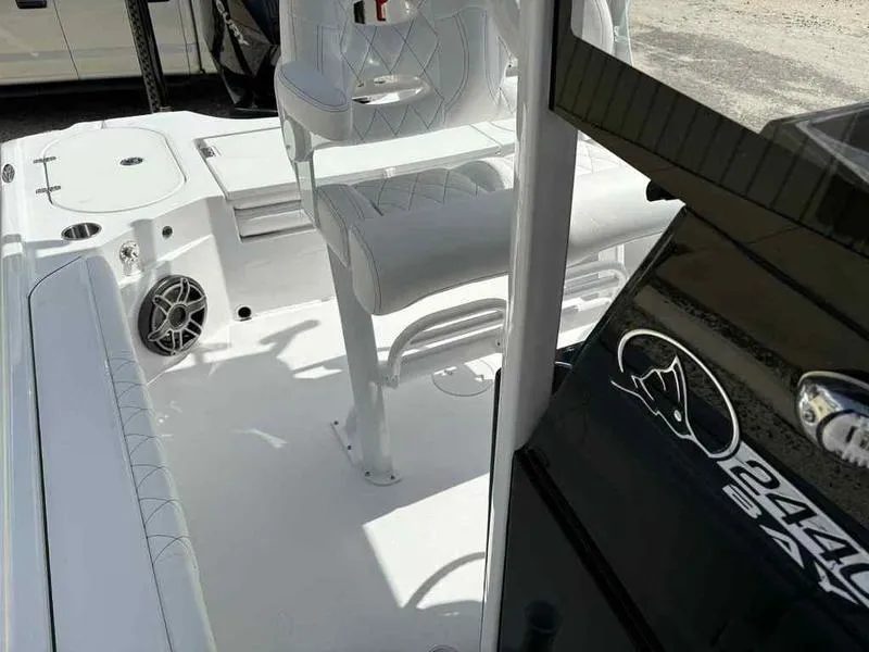 Slide: The Image of 2026 Blazer 2440 boat interior with white seating and speaker detail. - 9