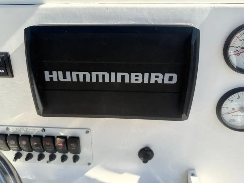 Slide: The Image of Dashboard of a 2014 Sea Fox 199 Commander with Humminbird display and gauges. - 15