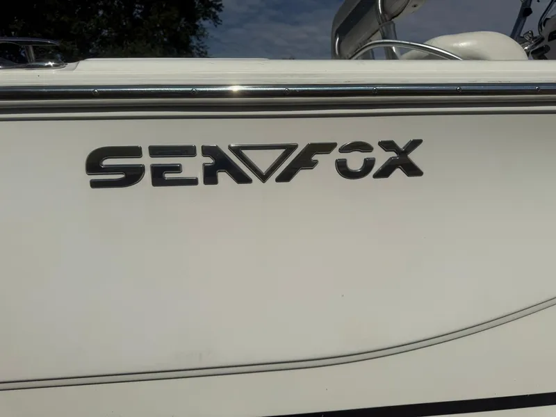 Slide: The Image of 2014 Sea Fox 199 Commander boat logo on white hull. - 17