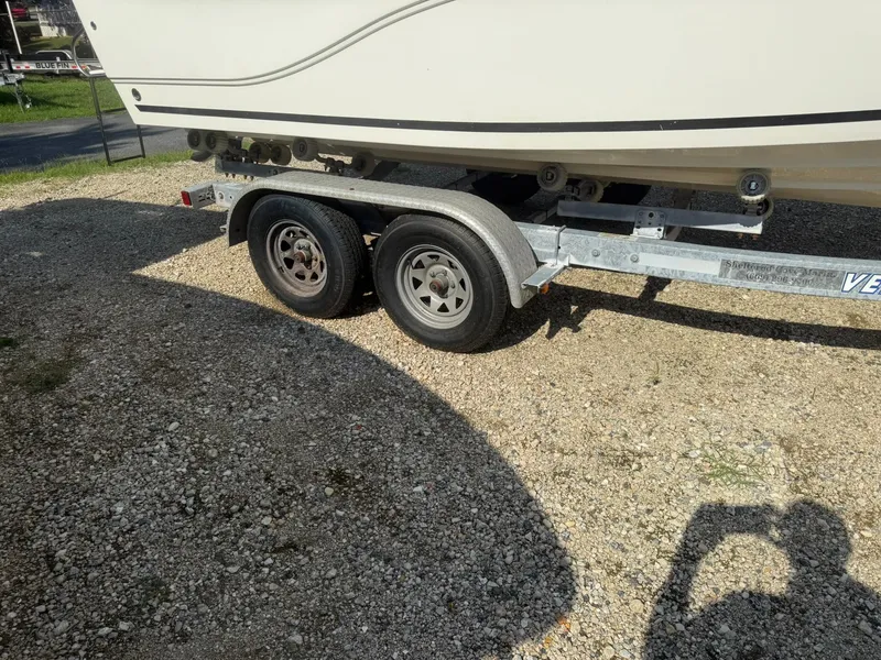 Slide: The Image of 2014 Sea Fox 199 Commander boat on a dual-axle trailer, parked on gravel. - 18