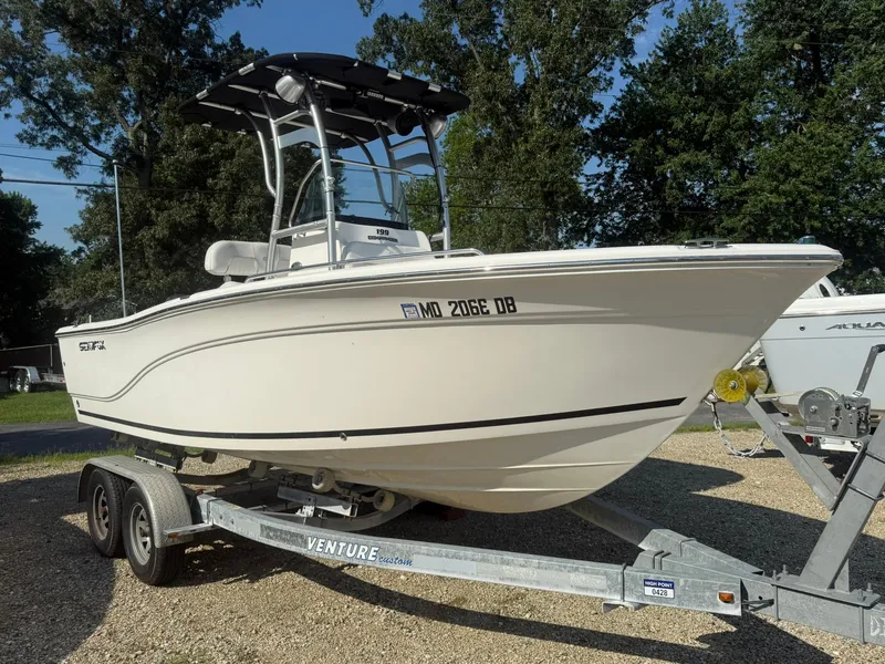 Slide: The Image of 2014 Sea Fox 199 Commander boat on trailer, parked outdoors. - 3