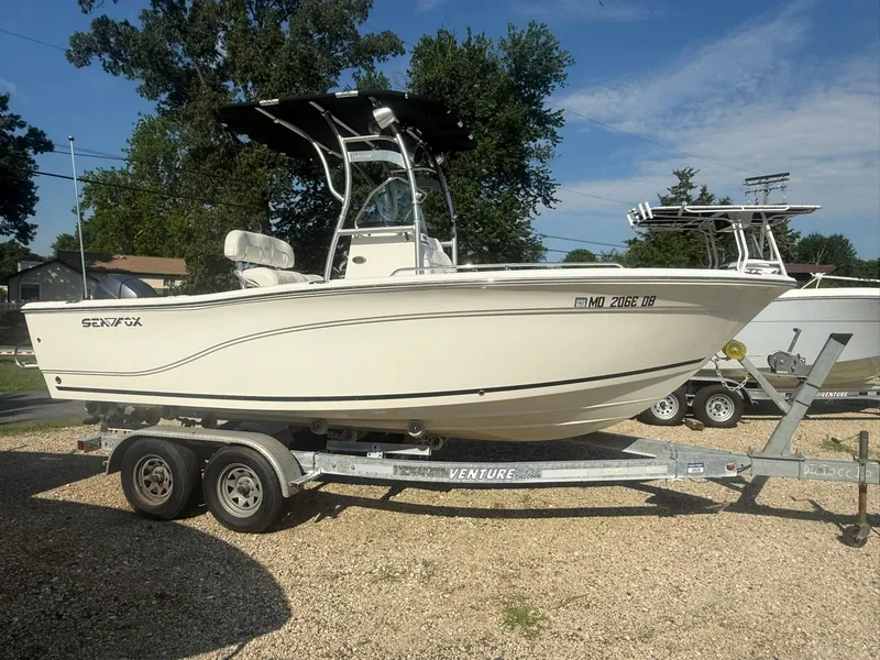 Slide: The Image of 2014 Sea Fox 199 Commander boat on trailer, parked outdoors. - 4