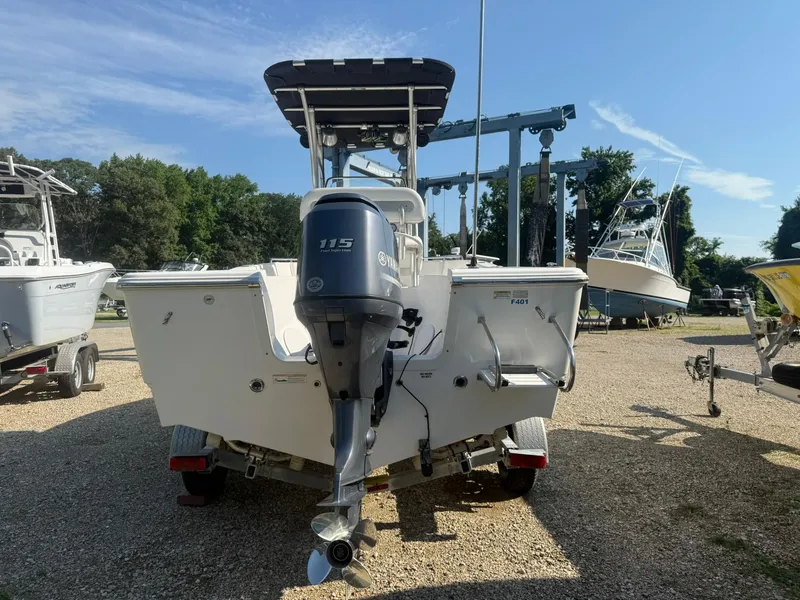 Slide: The Image of 2014 Sea Fox 199 Commander boat with Yamaha 115 engine, parked on gravel lot. - 5