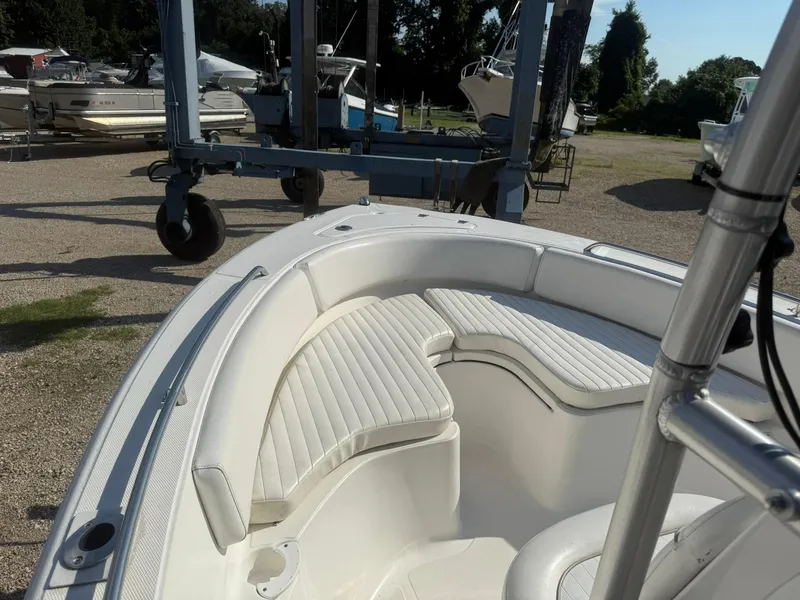 Slide: The Image of 2014 Sea Fox 199 Commander boat interior with white cushioned seating. - 8