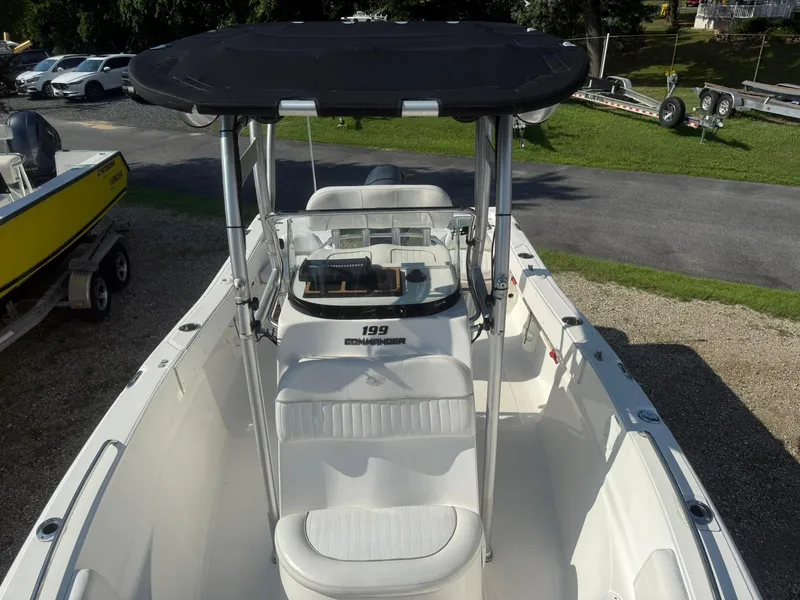 Slide: The Image of 2014 Sea Fox 199 Commander boat with T-top, parked on gravel. - 9