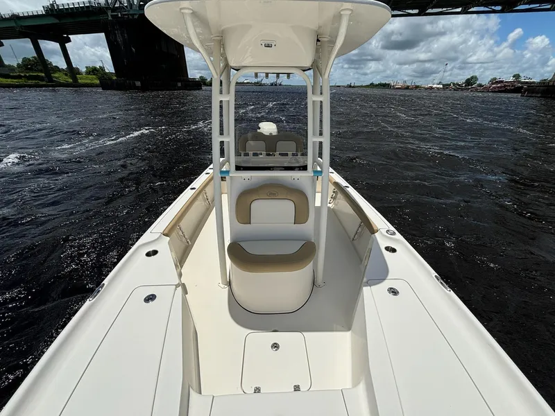 Slide: The Image of 2018 Key West 230 Bay Reef boat on water under a bridge, sunny day. - 6