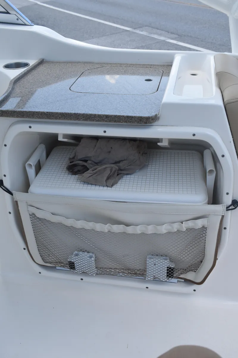 Slide: The Image of 2019 Key West 239 DFS boat interior storage compartment with cooler and countertop. - 10