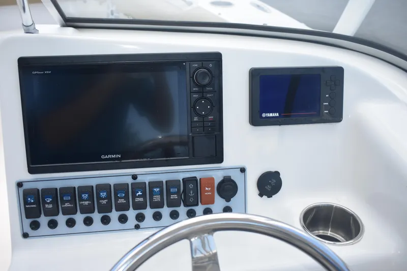 Slide: The Image of Control panel of 2019 Key West 239 DFS boat with Garmin and Yamaha displays. - 15