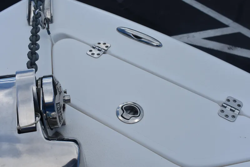 Slide: The Image of Close-up of 2019 Key West 239 DFS boat deck with anchor chain and hatch. - 24