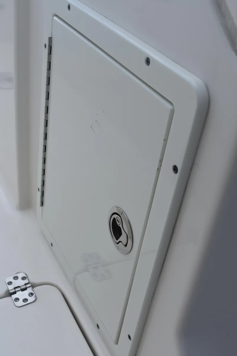 Slide: The Image of Access panel on 2019 Key West 239 DFS boat, featuring a secure latch. - 30