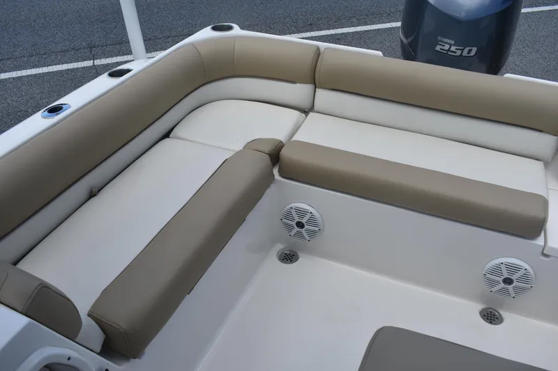 Slide: The Image of 2019 Key West 239 DFS boat interior with beige seating and Yamaha 250 engine. - 8