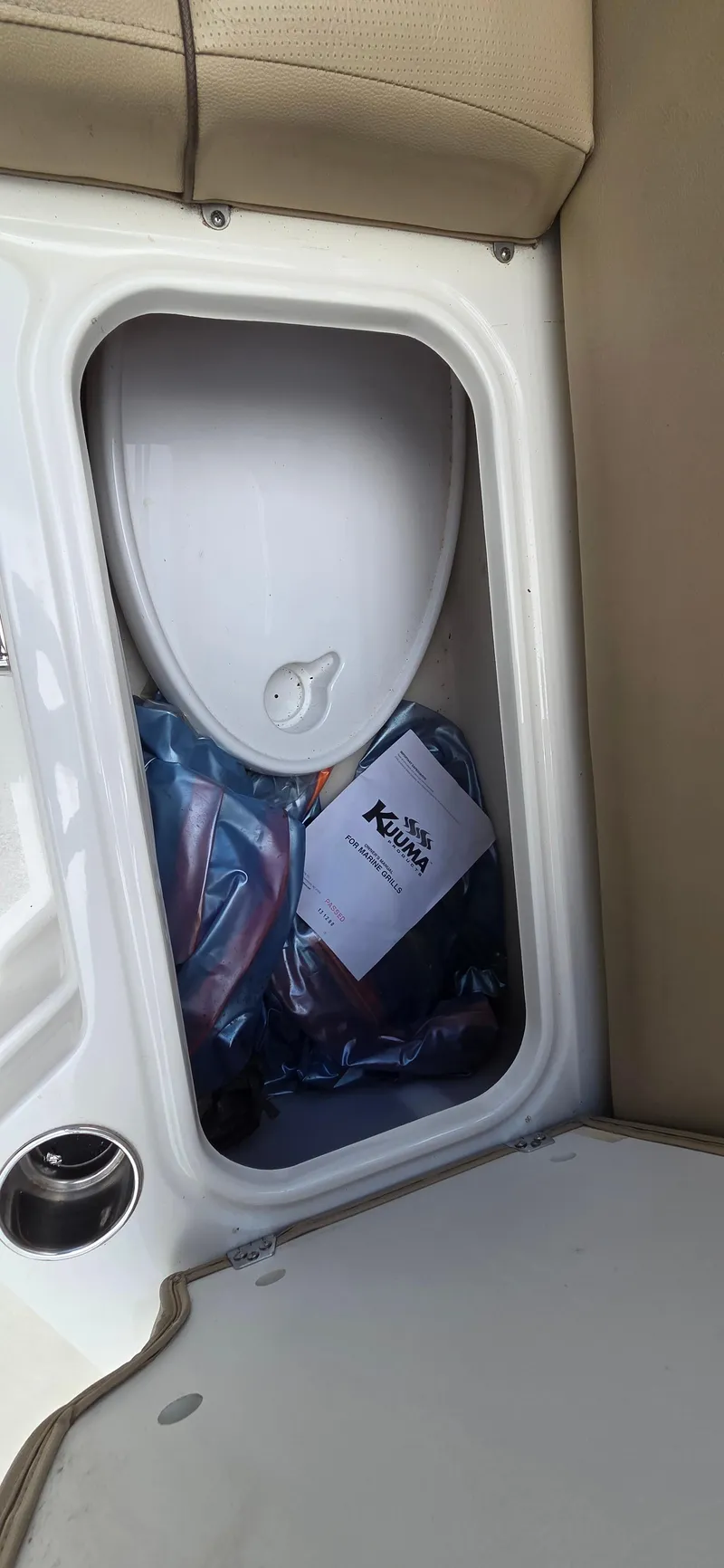 Slide: The Image of Storage compartment in 2019 NauticStar 223DC Sport Deck boat. - 11