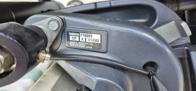 Slide: The Image of Yamaha F150XB engine detail on 2019 NauticStar 223DC Sport Deck boat. - 5
