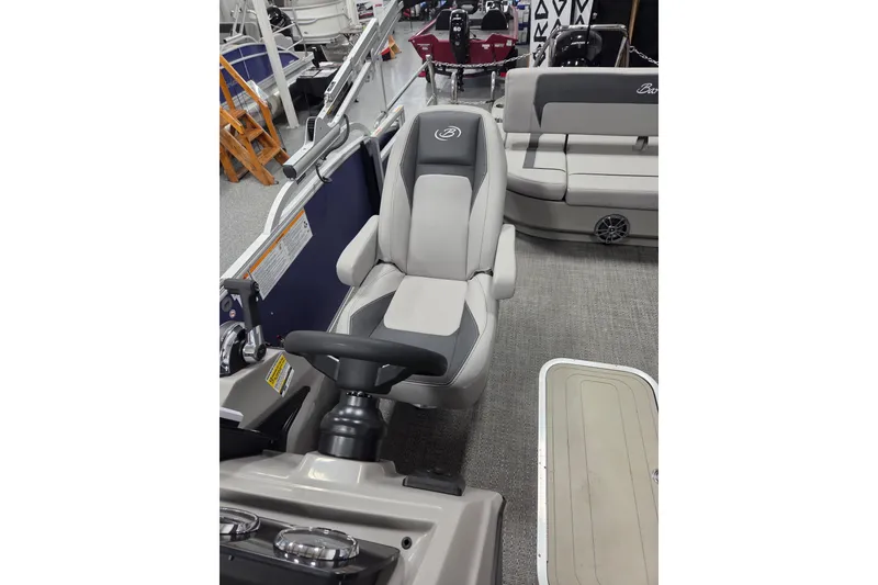 Slide: The Image of 2026 Barletta ARIA 22UC boat interior with steering wheel and seating. - 8