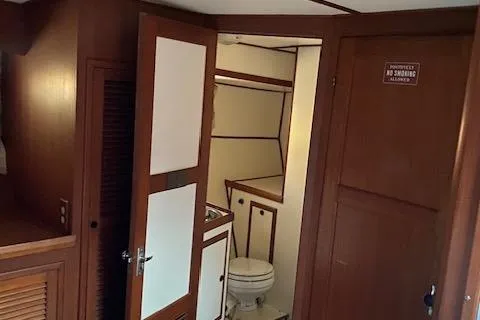 Slide: The Image of 1984 Nova Trawler Heritage interior with bathroom and wooden cabinetry. - 11