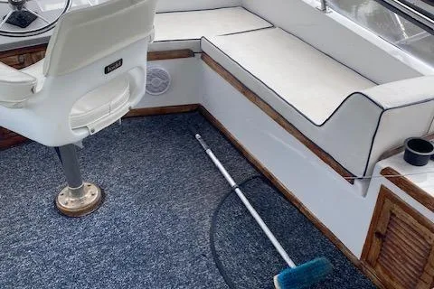 Slide: The Image of Interior of 1984 Nova Trawler Heritage boat with seating and carpeted floor. - 6