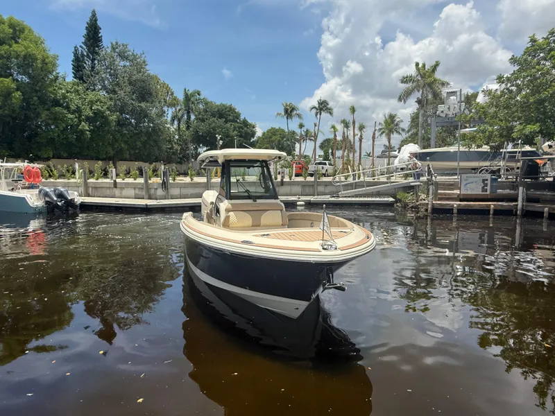 Slide: The Image of 2025 Chris-Craft Catalina 28 boat docked in a scenic marina setting. - 10