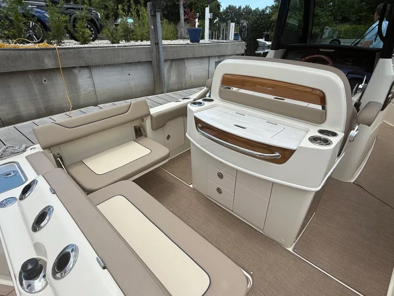 Slide: The Image of 2025 Chris-Craft Catalina 28 interior with seating and storage, featuring elegant design and craftsmanship. - 16