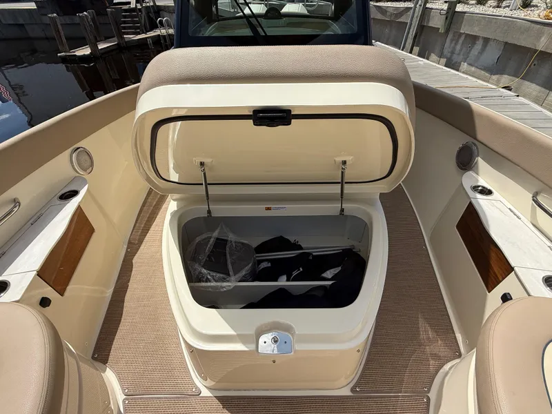 Slide: The Image of 2025 Chris-Craft Catalina 28 boat interior with open storage compartment. - 34
