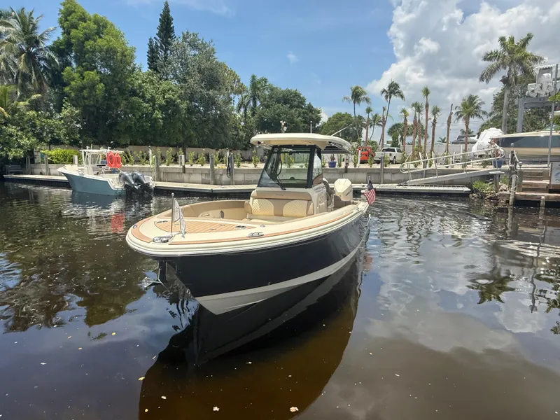 Slide: The Image of 2025 Chris-Craft Catalina 28 boat docked in a scenic marina setting. - 9